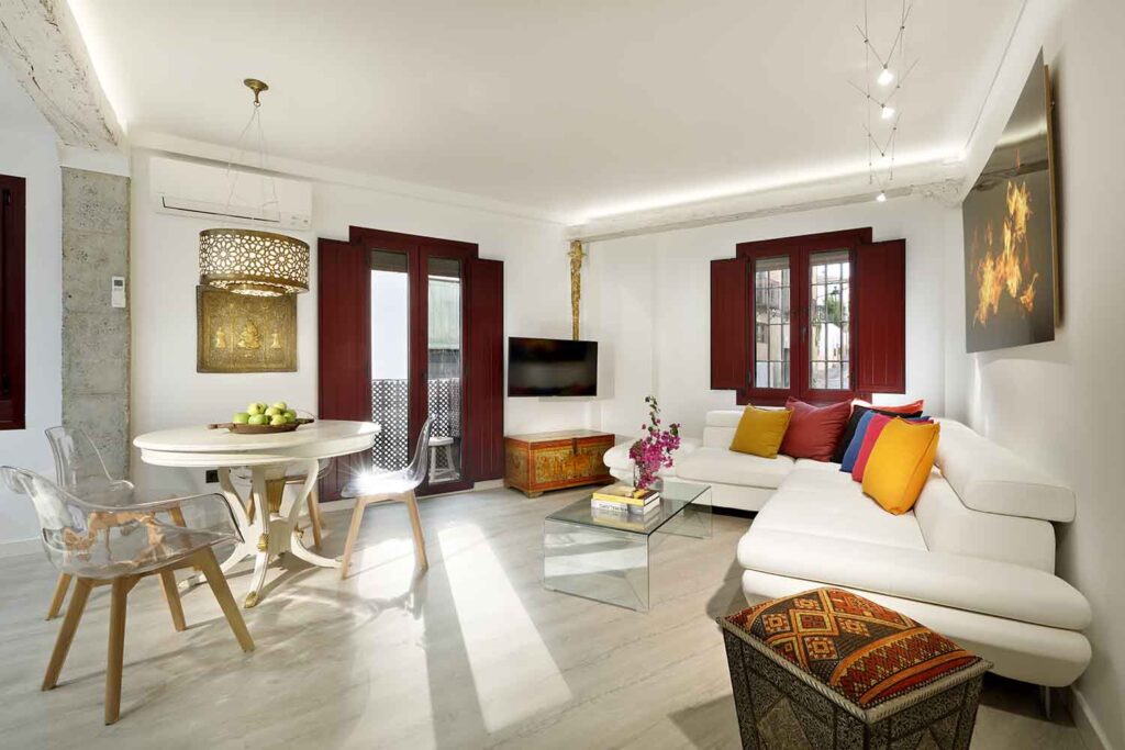 living room with sofa bed and dining table in luxury accommodation near alhambra granada