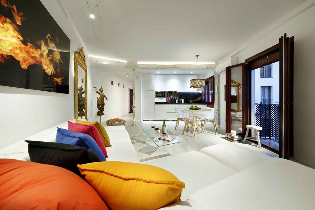 corner white leather sofa bed in open concept livingroon in new apartment for rent albayzin granada