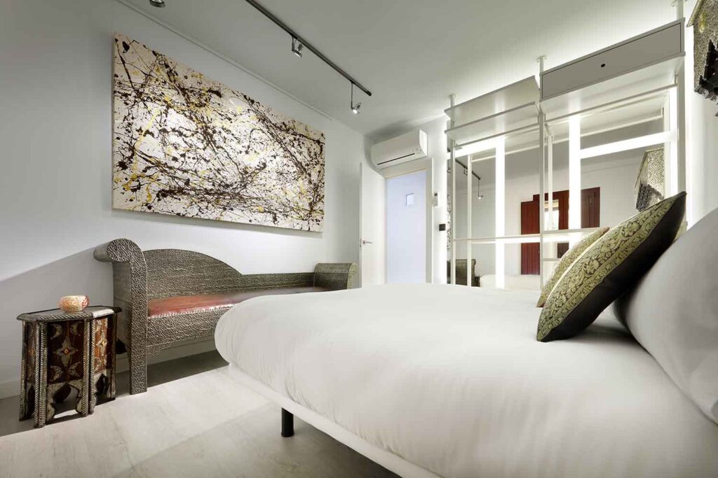 modern art in boutique bedroom in airbnb apartment, albaicin, granada, spain