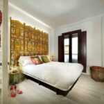 double bedroom with Indian headboard in fancy apartment for rent, albayzin, granada, spain