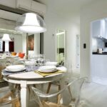 art chapiz modern apartment for rent with dining table set for four people in granada