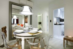 art chapiz modern apartment for rent with dining table set for four people in granada