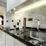 modern integrated kitchen in cozy short term apartment rental in the albaicin quarter, granada